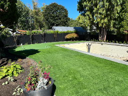 artificial turf installed in a narrow backyard