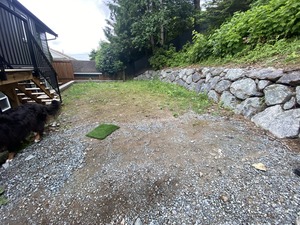 backyard with dirt and gravel