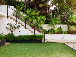 A luscious backyard with an artificial turf installation